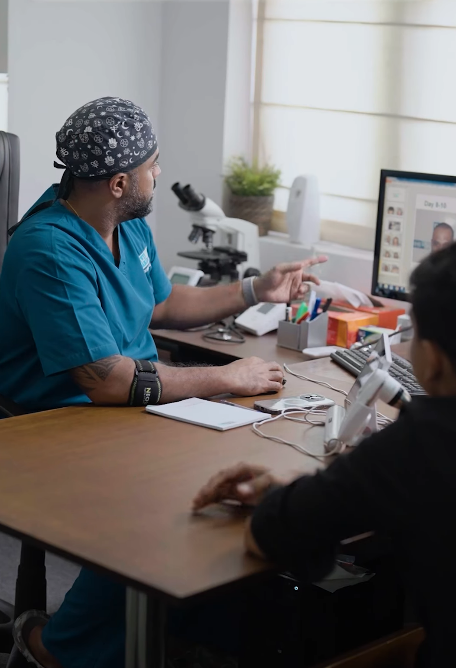 Surgeon reviewing hair transplant results with a patient during consultation